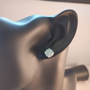 Opal stud earrings with sterling silver plating.